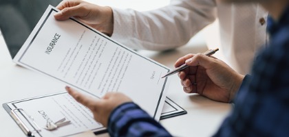 man-in-office-showing-an-insurance-policy-and-pointing-with-a-pen-where-the-policyholder-must.jpg_s=1024x1024&w=is&k=20&c=khS5b0xO8A9XG7AgaMDES8cd8BDkO572L81HErEWwxc=